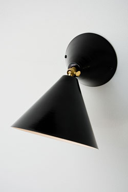 Black wall lamp with adjustable cone white inside. Atelier Areti. 