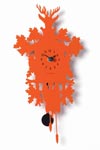 Coucou mignon pendule en métal découpé orange vif. Diamantini & Domeniconi. Coucou mignon pendule en métal découpé orange vif. Diamantini & Domeniconi.