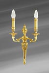 Applique Louis XVI patiné vieil or, deux lumières. Lucien Gau. Applique Louis XVI patiné vieil or, deux lumières. Lucien Gau.