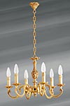 Lustre bronze Louis XV six lumières. Lucien Gau. Lustre bronze Louis XV six lumières. Lucien Gau.