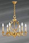 Lustre en bronze doré Louis XV six lumières. Lucien Gau. Lustre en bronze doré Louis XV six lumières. Lucien Gau.