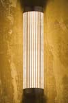 Polished bronze cylindrical and fluted glass wall light. Nautic by Tekna. Polished bronze cylindrical and fluted glass wall light. Nautic by Tekna.