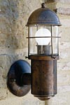 Outdoor wall lamp with lighthouse lantern, grid and cylinder. Aldo Bernardi. 