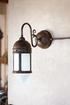 Postierla patinated brass country-style wall lamp. Aldo Bernardi. 