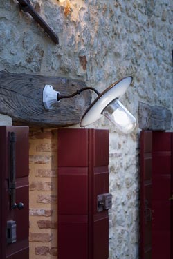 Patina brass and porcelain outdoor wall light with clear glass. Aldo Bernardi. 