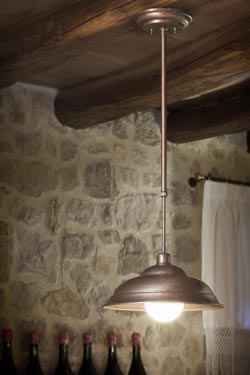 Patinated copper pendant on rigid rod adjustable in height. Aldo Bernardi. 