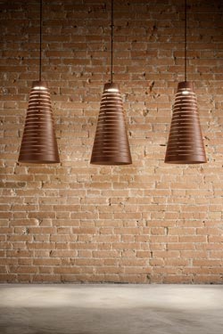 Perforated cone pendant in corten steel. Aldo Bernardi. 