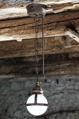 Frosted globe pendant with chain and tube in aged patinated brass. Aldo Bernardi. Frosted globe pendant with chain and tube in aged patinated brass. Aldo Bernardi.
