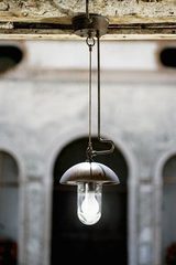 Round pendant lamp with tube dome and rod in aged brass and white porcelain. Aldo Bernardi. Round pendant lamp with tube dome and rod in aged brass and white porcelain. Aldo Bernardi.