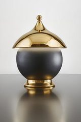 Table lamp in gold ceramic and matt black sphere. Aldo Bernardi. 