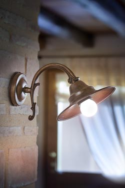 Wall lamp on bracket in aged brass and aged copper M. Lescaut. Aldo Bernardi. 