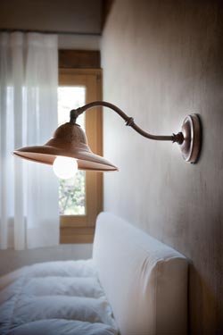 Wall lamp on bracket in aged brass and aged copper M. Lescaut. Aldo Bernardi. 