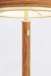 Lampe de table en rotin et laiton antique Annette. Arteriors.