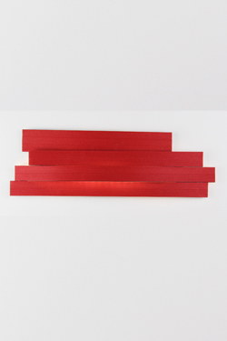 Long red wall lamp in pressed cellulose. Arturo Alvarez. 