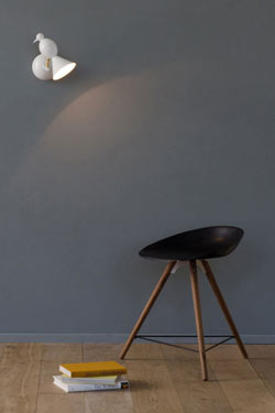 Alouette design white wall light to the left. Atelier Areti. 