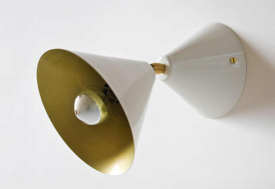 White lacquered cone wall light with golden interior. Atelier Areti. 