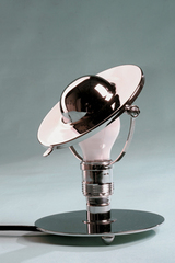 Small chrome metal table lamp with reclining lampshade. Contract&More. Small chrome metal table lamp with reclining lampshade. Contract&More.