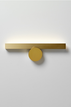 Golden wall lamp, lighting up. CVL Luminaires. 