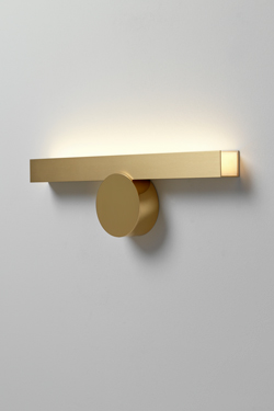 Golden wall lamp, lighting up. CVL Luminaires. 