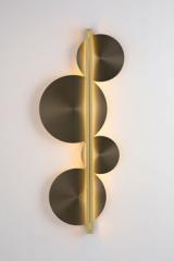 Strate Moon black and gold disc sconce. CVL Luminaires. 