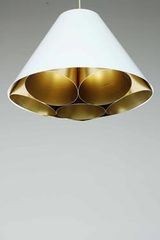 Conical pendant lamp in white and gold metal. Dark. 