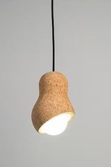 Small designer pendant light, in cork, peanut shape. Dark. 