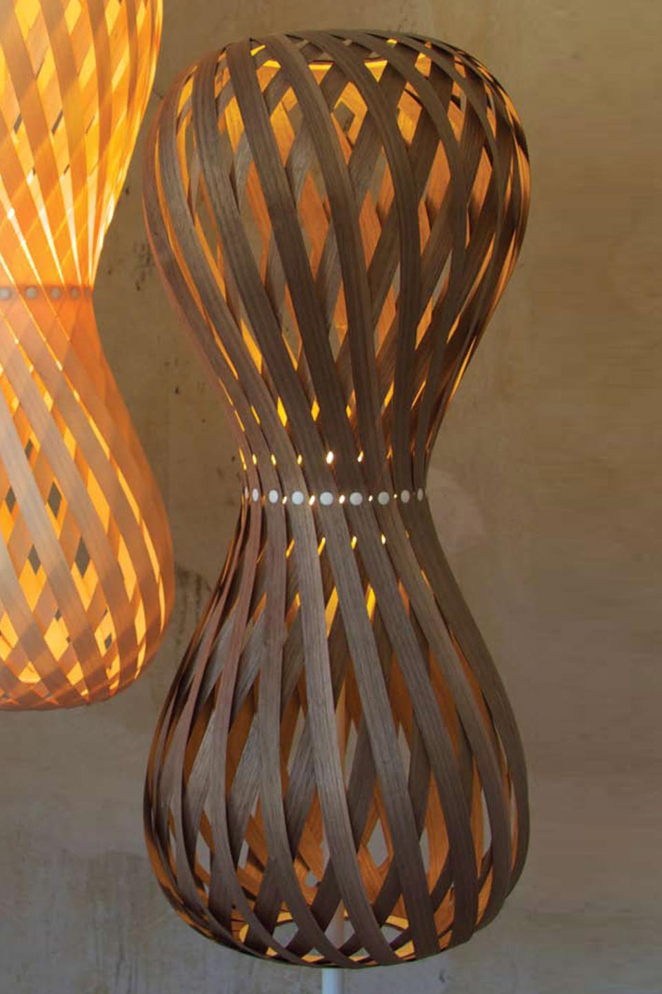 Swing floor lamp shaped hourglass rounded slats of walnut wood. Dreizehngrad 13°. 