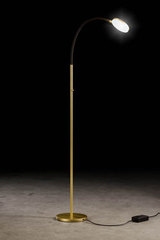 Flex reading light in gold metal and flexible arm in black fabric. Holtkötter. 
