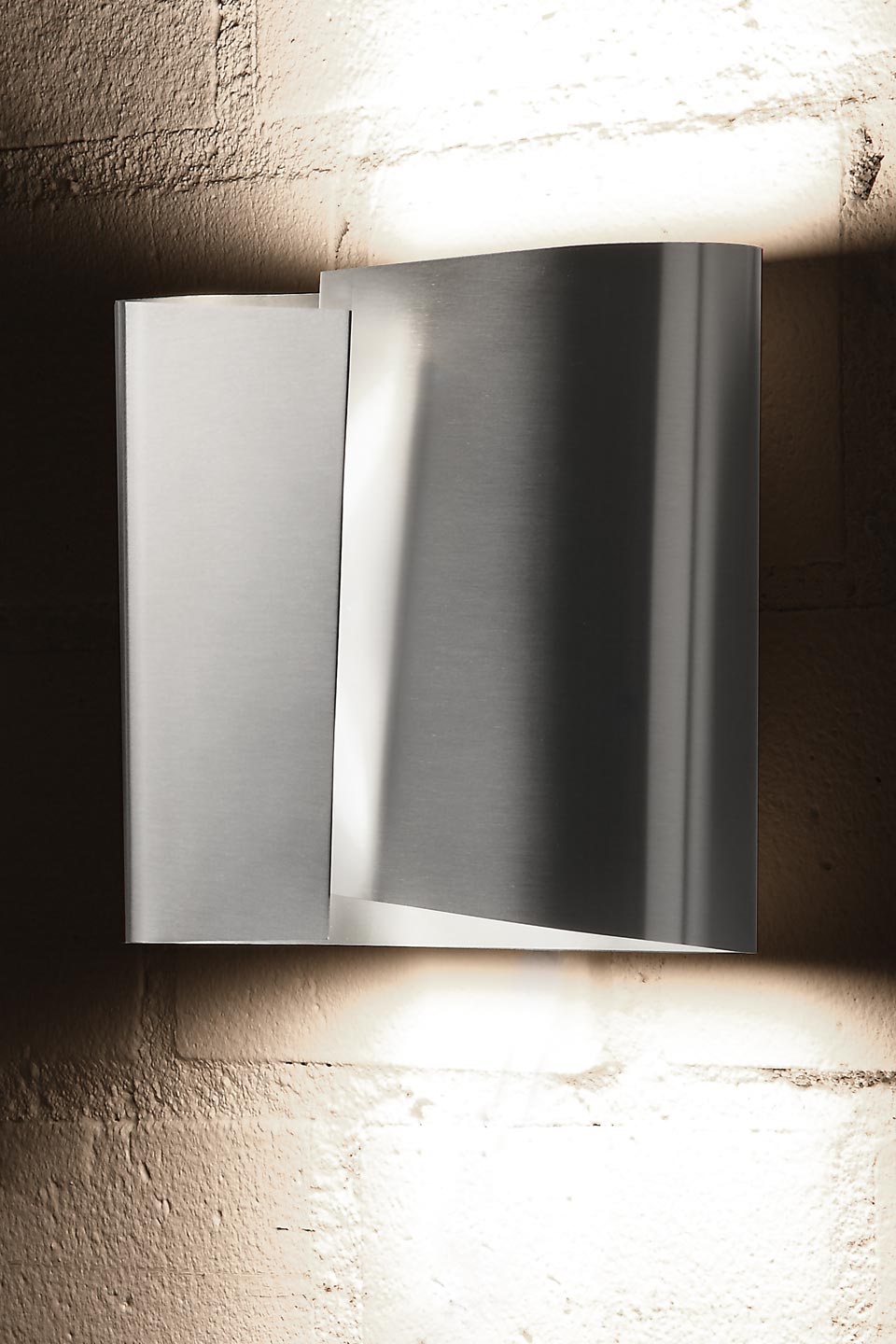 Large brushed stainless steel curved leaf wall light. Holtkötter. 