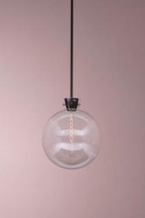Clear glass bubble and black metal pendantETU. KAIA. Clear glass bubble and black metal pendantETU. KAIA.