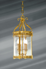 Lanterne en verre et bronze massif travaillé de style classique à quatre lumières . Lucien Gau. Lanterne en verre et bronze massif travaillé de style classique à quatre lumières . Lucien Gau.