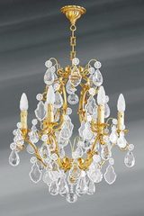Lustre doré Louis XV cristal de bohème six lumières. Lucien Gau. Lustre doré Louis XV cristal de bohème six lumières. Lucien Gau.