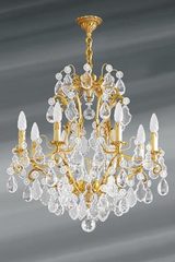 Lustre Louis XV bronze vieil or et cristal de bohème huit lumières. Lucien Gau. Lustre Louis XV bronze vieil or et cristal de bohème huit lumières. Lucien Gau.