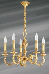 Lustre Louis XV bronze vieil or feuilles et perles cinq lumières . Lucien Gau. Lustre Louis XV bronze vieil or feuilles et perles cinq lumières . Lucien Gau.