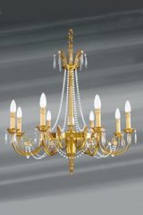 Lustre style Directoire doré cristal de bohème en perles huit lumières. Lucien Gau. Lustre style Directoire doré cristal de bohème en perles huit lumières. Lucien Gau.
