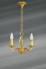 Petit lustre trois lumières de style Louis XVI en bronze massif doré. Lucien Gau. Petit lustre trois lumières de style Louis XVI en bronze massif doré. Lucien Gau.