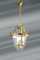 Suspension ovoïdale en bronze et verre trois lumières. Lucien Gau. Suspension ovoïdale en bronze et verre trois lumières. Lucien Gau.