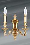 Golden Louis XIV wall lamp with two lights. Lucien Gau. 
