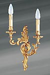 Golden Louis XV wall light in solid bronze. Lucien Gau. 