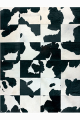Tapis Patchwork en peau de vache tachetée noir 140X200. MA Salgueiro. Tapis Patchwork en peau de vache tachetée noir 140X200. MA Salgueiro.