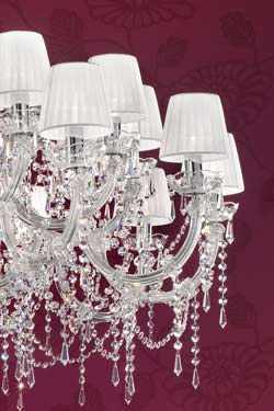White, chrome-plated metal and clear crystal designer chandelier . Masiero. 