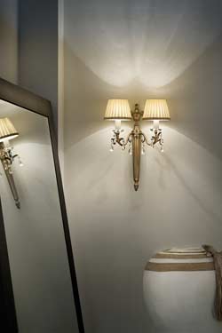 Matt old-gold and crystal wall light with cream shades. Masiero. 
