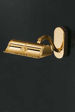 Gold-plated bedside wall light with engraved pattern. Masiero. 