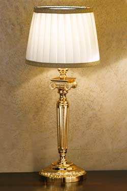Gold-plated bronze table lamp with round base. Masiero. 