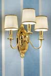 Triple wall light in gold-plated bronze with beige silk shades. Masiero. 