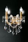 Twin wall light in clear crystal with gold-plated-metal scrolled arms. Masiero. 