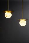 Moons round pendant in alabaster and satin brass. Matlight. 