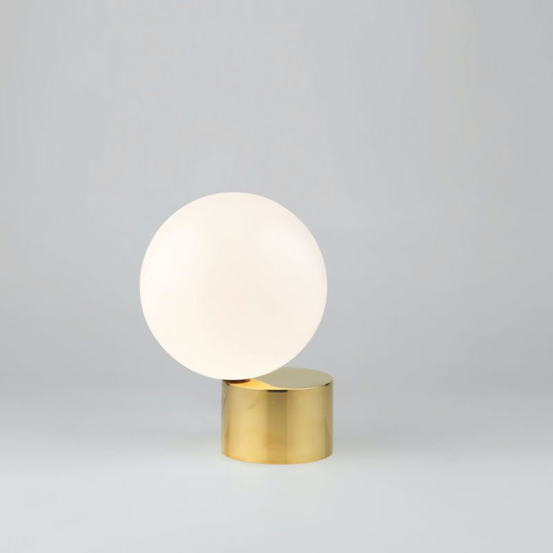 White table lamp on polished brass base Tip of the Tongue. Michael Anastassiades. 