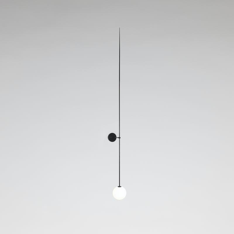 Long black patinated brass applique with a white globe. Mobile Chandelier10. Michael Anastassiades. 