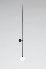 Long black patinated brass applique with a white globe. Mobile Chandelier10. Michael Anastassiades. 